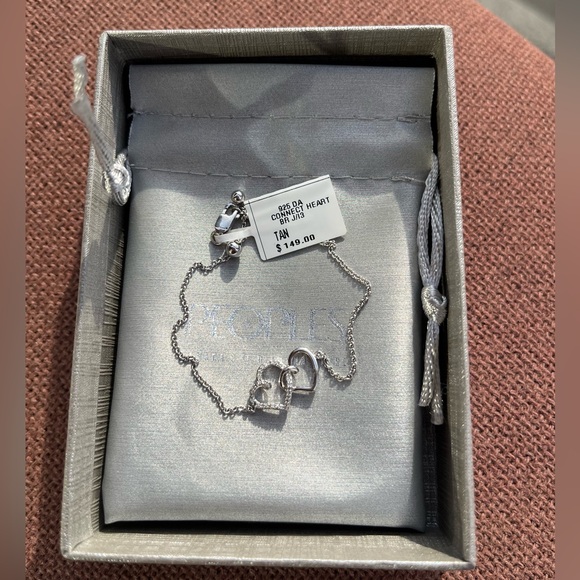 0.04 CT. T.W. Diamond Interlocking Hearts Bracelet in Sterling Silver - 6.75" - Picture 9 of 10